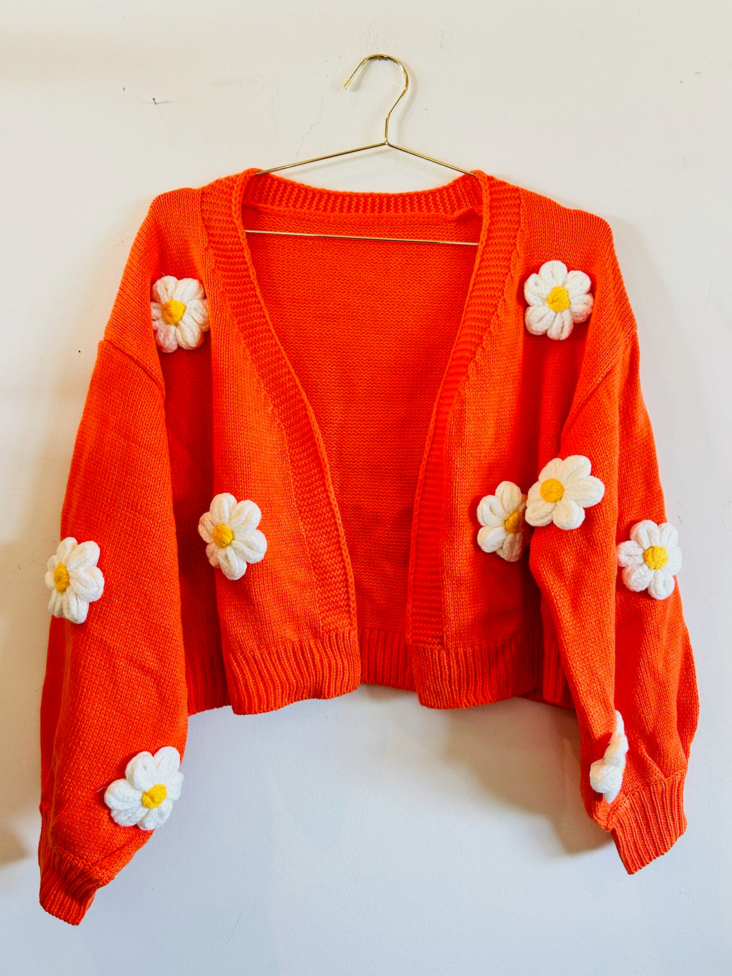 White 3D Daisy on Orange Cardigan