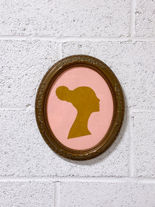 Vintage Silhouette of a Woman in Ornate Frame