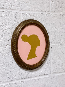 Vintage Silhouette of a Woman in Ornate Frame