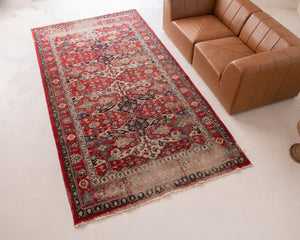 Distressed Antique Persian Rug